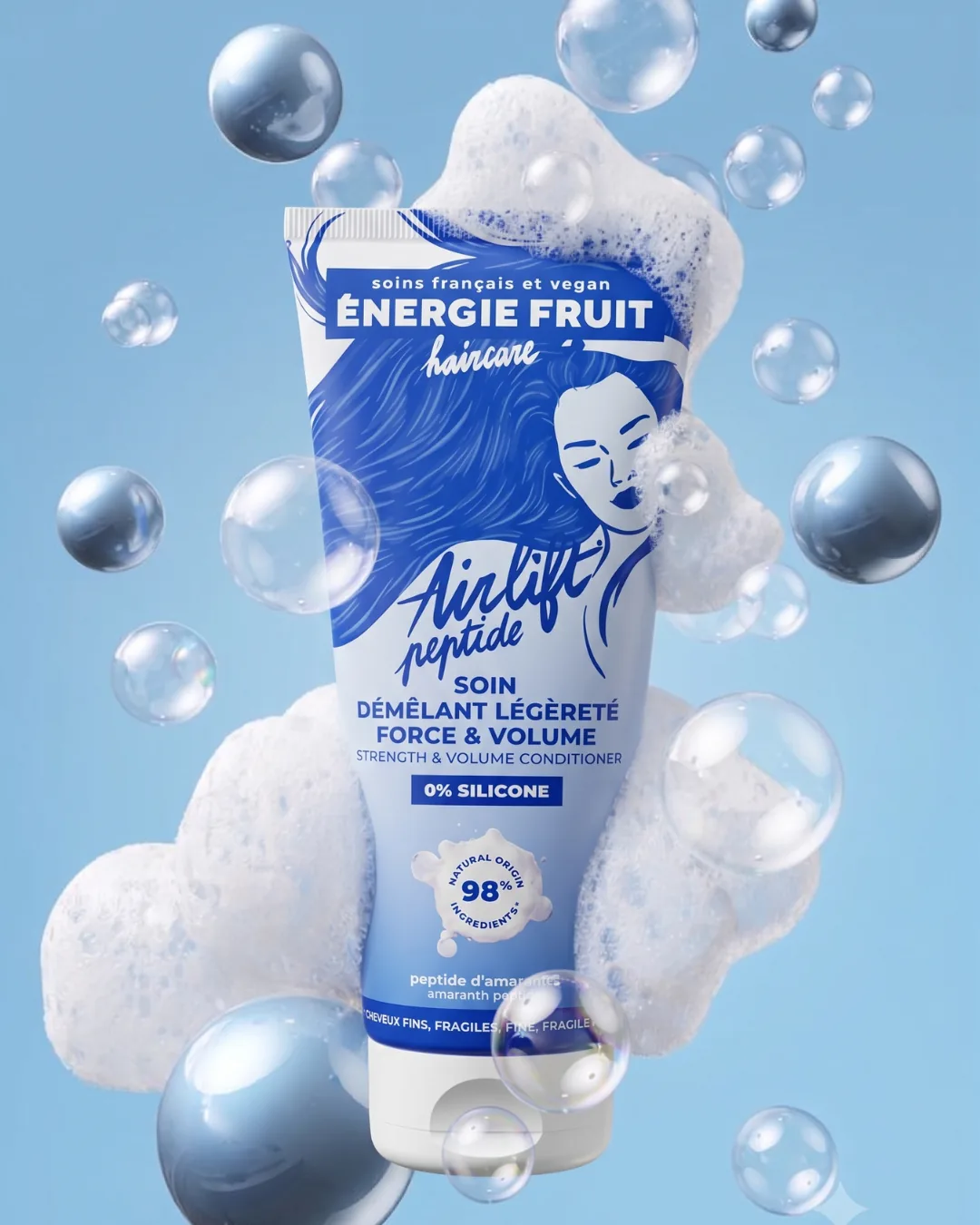 Énergie Fruit Airlift peptide conditioner amid foam and floating bubbles on pale blue